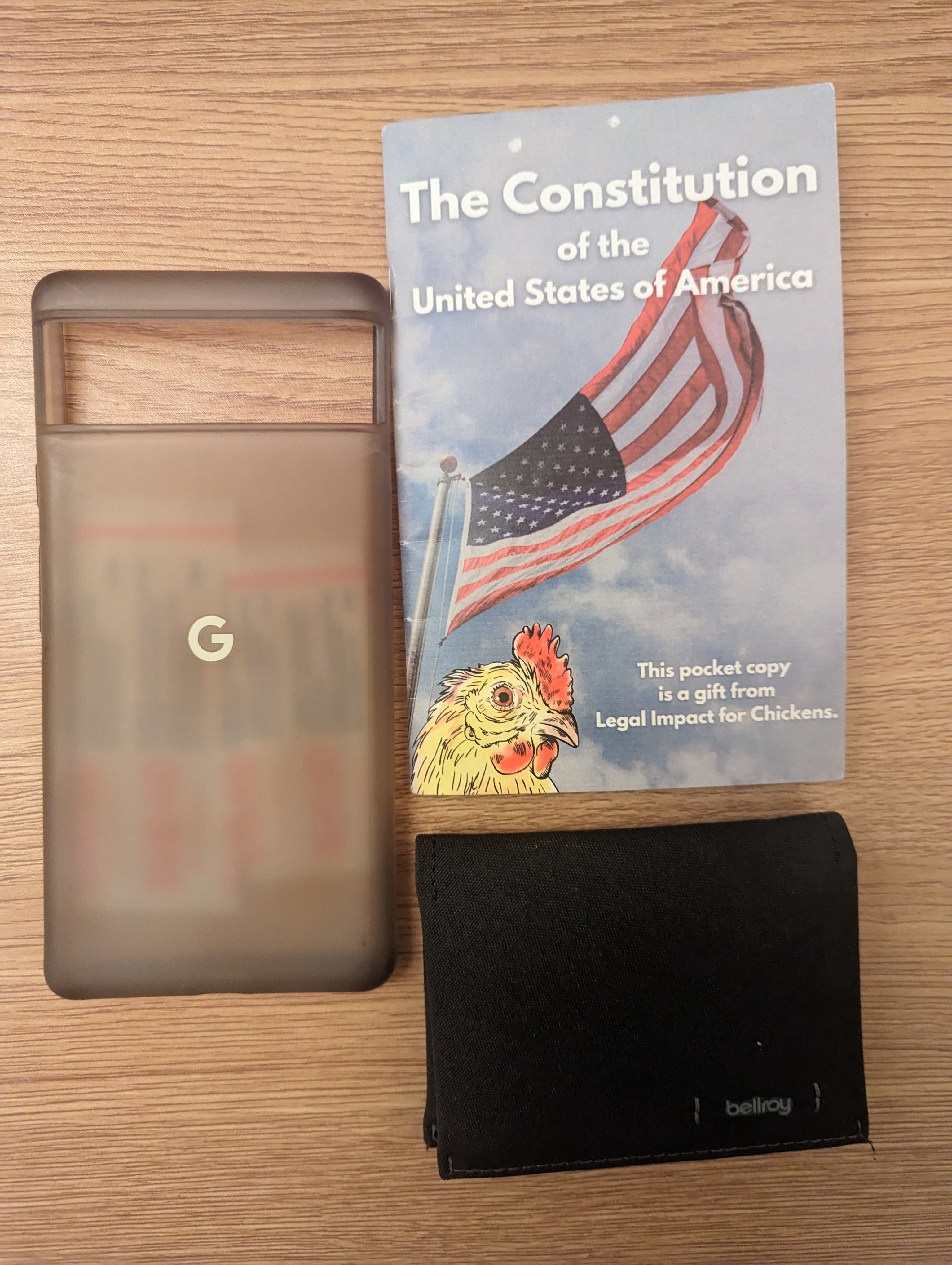 Pocket items: pocket constitution, phone case, and wallet
